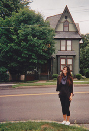 Natalia in front of Hauprich family homestead.