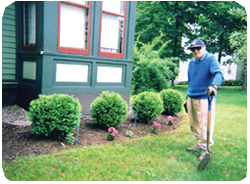 Donald G. Hauprich recently tending his garden.